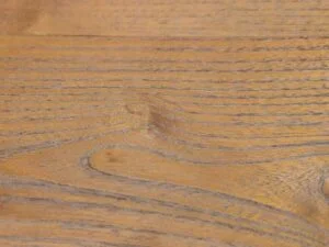 Open pore finishing on solid teak wood furniture showcasing natural wood grain texture and premium craftsmanship.